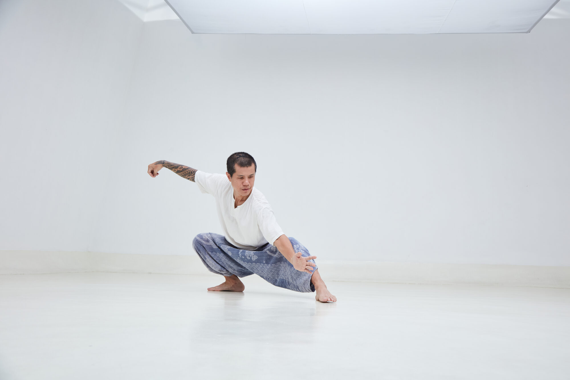 Kay, Metta Dojo founder, in a grounded Karate posture